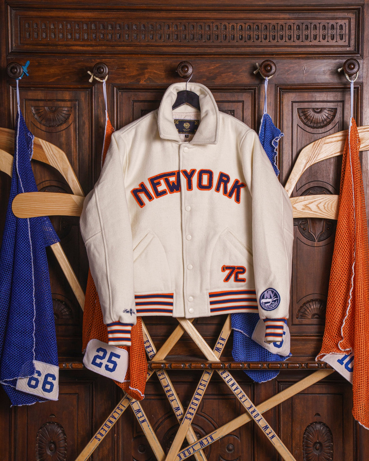 Front view of white Islanders Primary Varsity Jacket